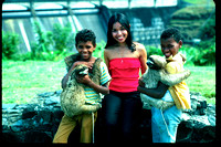 Panamanian youngsters with pet 3-toed sloths